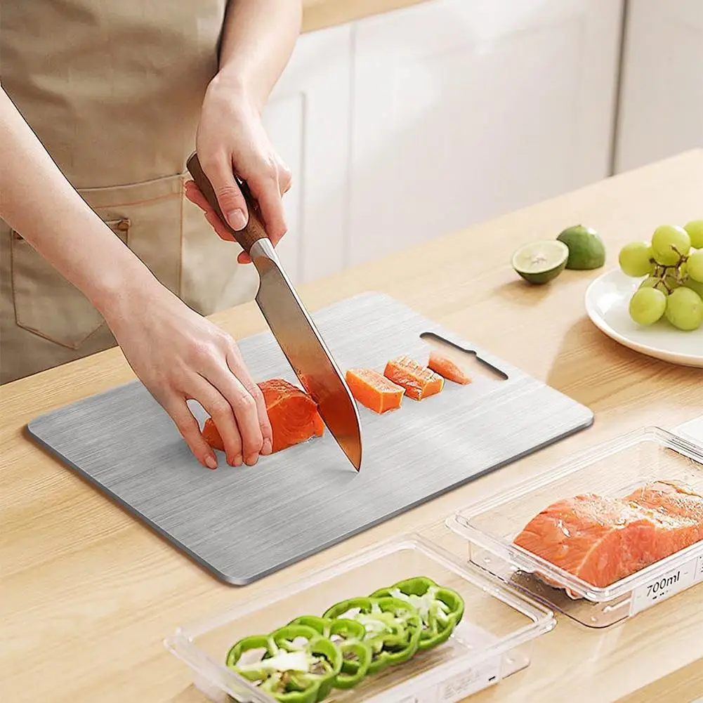 The stainless steel cutting board in use for everyday food prep